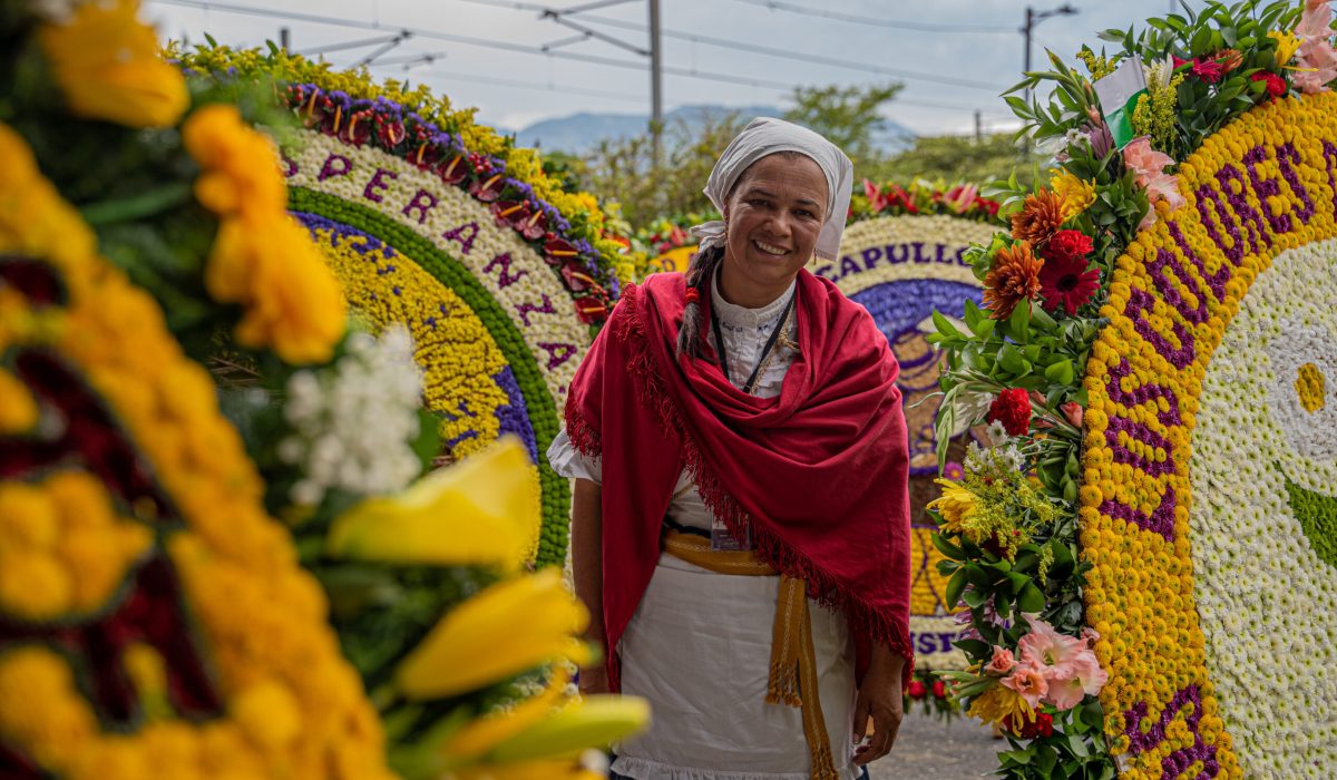 15 August 2022, Colombia, Santa Elena Antioquia: A Silletera woman in traditional costume waits before the Silletero parade as part of the Medellin Flower Festival. Photo: Edinson Arroyo/dpa (Photo by Edinson Arroyo/picture alliance via Getty Images)